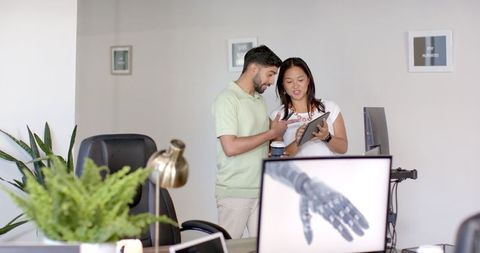 Colleagues Collaborating on Modern Office Project