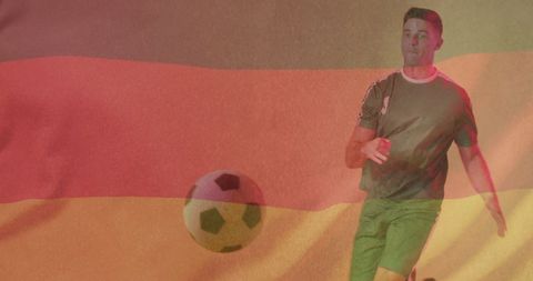 Male football player with germany flag background