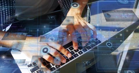 Man typing on laptop with augmented reality hud overlays and data analytics on glass table