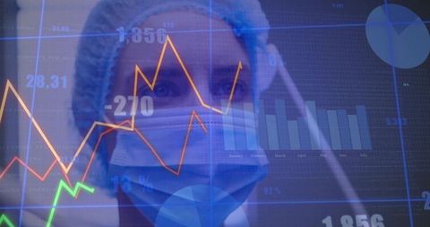 Clinician Analyzing Digital Data in Medical Environment