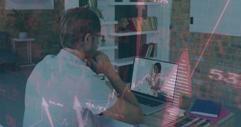 Focused Man Analyzing Financial Growth Chart on Laptop