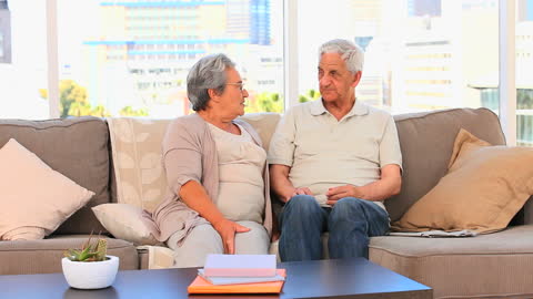Senior Couple Relaxing in Living Room Sharing a Moment of Connection