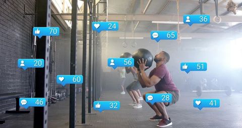 Group workout with medicine balls and social media engagement icons