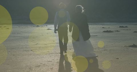 Newlywed Couple Holding Hands on Beach Promenade - Download Free Stock Images Pikwizard.com