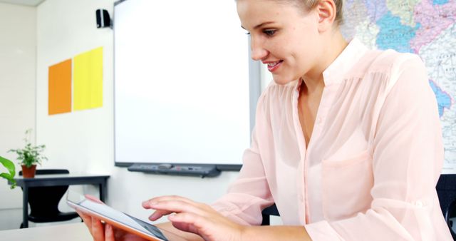 Teacher Using Tablet in Modern Classroom - Download Free Stock Images Pikwizard.com