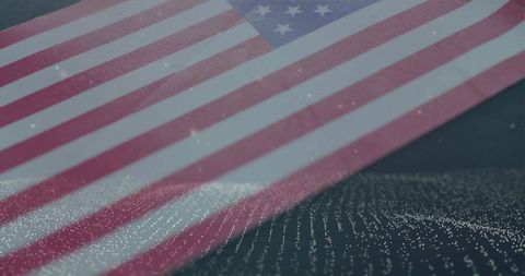 Draping american flag over led microdot matrix with bokeh glow and granular texture