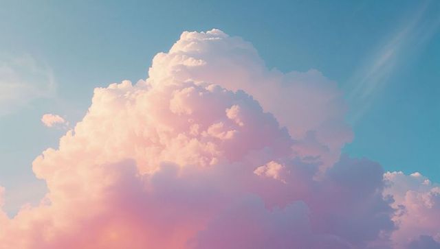 Dreamy Pink Cumulonimbus Clouds Against Blue Sky