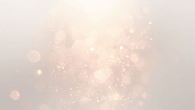 Warm Central Bokeh Glow with Soft Sparkling Orbs and Ethereal Shimmering Light