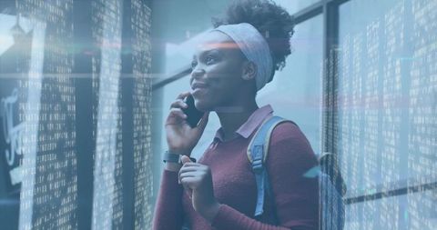 Woman using smartphone with futuristic digital overlay