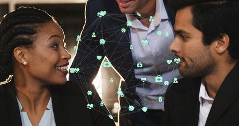 Diverse Team Collaborating with Digital Networking Visuals