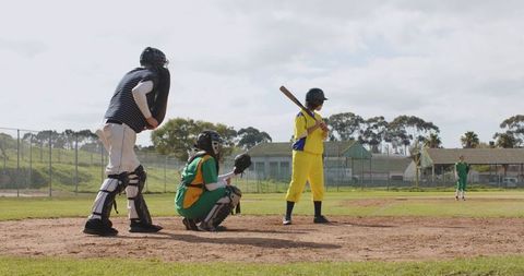 Youth Baseball Game Action at Community Park