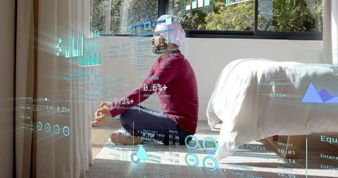 Man meditating in sunlit bedroom with ar data holograms projecting over bed and window