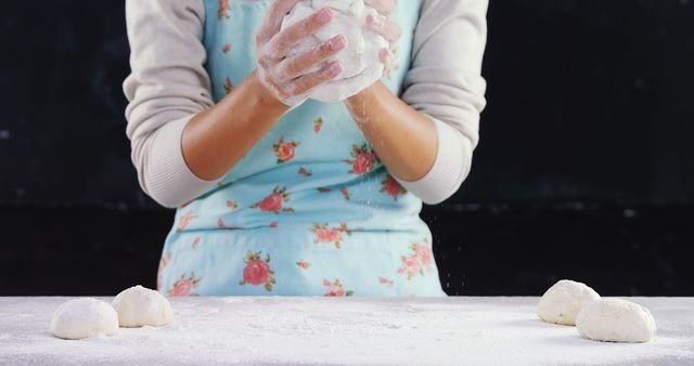 Woman Kneading Dough Wearing Floral Blue Apron in Kitchen - Download Free Stock Images Pikwizard.com