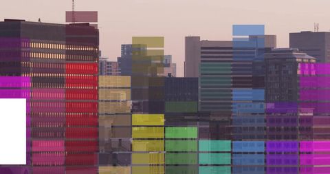 Urban skyline with multicolor block glitch overlay on glass and concrete towers at dusk