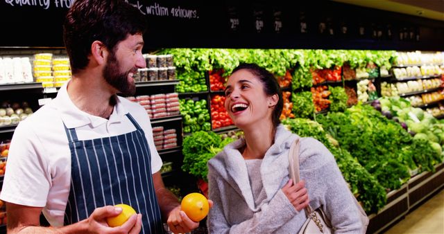 Friendly Grocery Clerk and Happy Customer in Fresh Produce Aisle - Download Free Stock Images Pikwizard.com