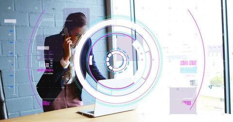 Executive juggling smartphone and laptop while interacting with futuristic hud in office