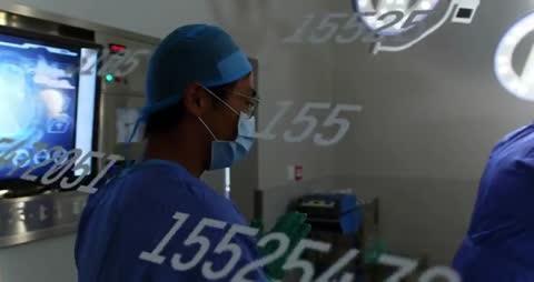 Surgeon Engaged with Digital Data Overlay in High-Tech Operating Room