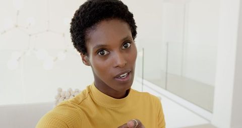 Elegant Professional Woman Standing in Minimalist Home