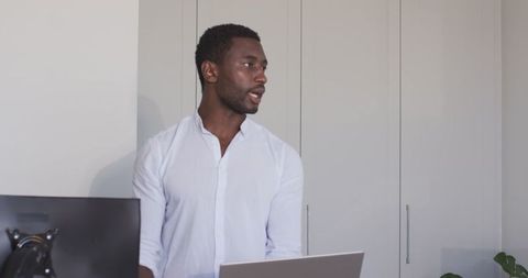 Confident Professional Using Tablet in Modern Office Environment