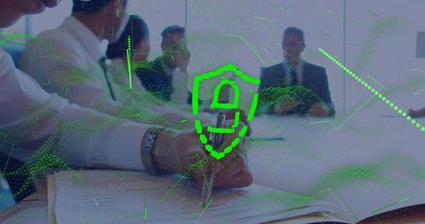 Business team collaborating on data protection strategy with digital shield overlay in office