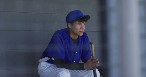 Nervous Young Female Baseball Player Waiting in Dugout - Download Free Stock Images Pikwizard.com
