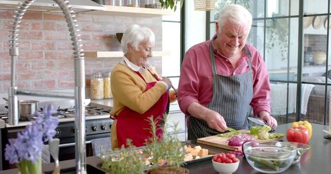 Senior Couple Cooking Together in Stylish Kitchen