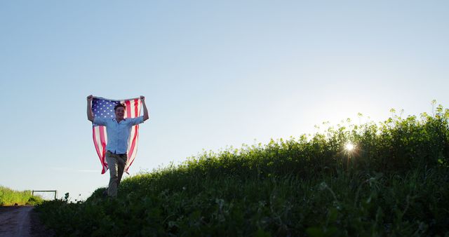 Young Man Carrying American Flag Over Green Field - Download Free Stock Images Pikwizard.com