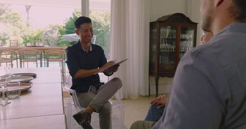 Wedding planner consults couple on event details indoors