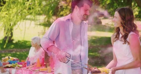 Family Enjoying Outdoor BBQ Celebration Gathering Sunshine Happiness