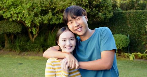 Joyful Couple Embracing in Outdoor Garden Happiness