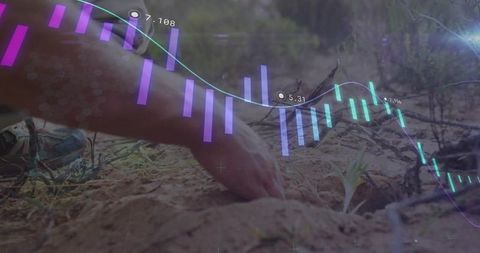 Hands protecting seedling with futuristic graph overlay
