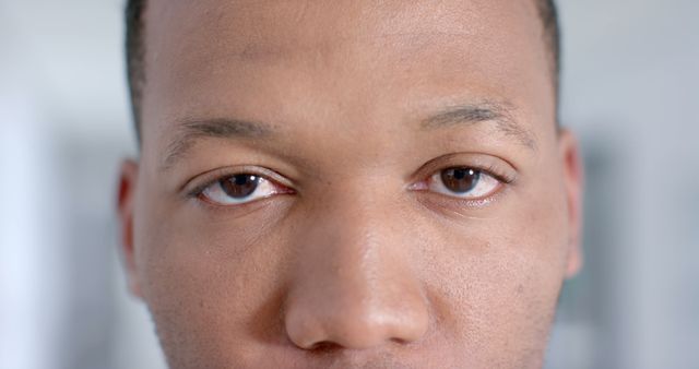 Close-Up of Young Adult Man's Face with Thoughtful Expression - Download Free Stock Images Pikwizard.com