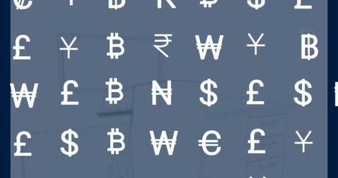 Modern financial concept with currency symbols at workspace