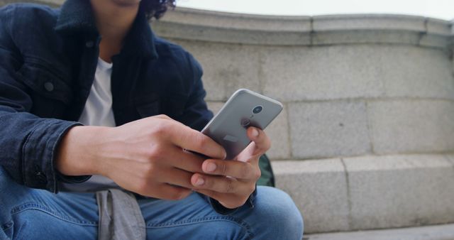 Teenager Checking Smartphone Outdoors in Urban Area - Download Free Stock Images Pikwizard.com