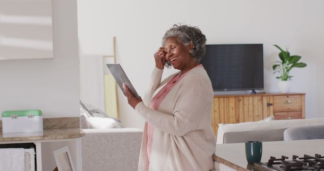 Happy Senior Woman Using Tablet at Home - Download Free Stock Images Pikwizard.com