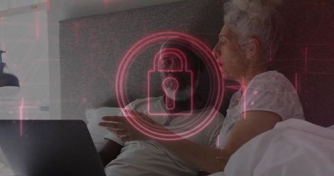 Couple using laptop in bed with glowing red padlock overlay representing online privacy