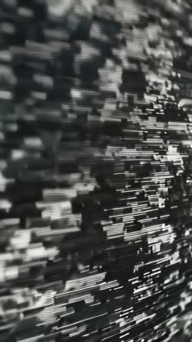 Vertical glitch animation showing collapsing scanlines and pixel grid in monochrome loop