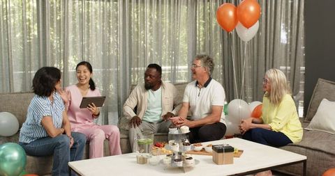 Diverse Group in Therapy Center Celebrating New Arrival