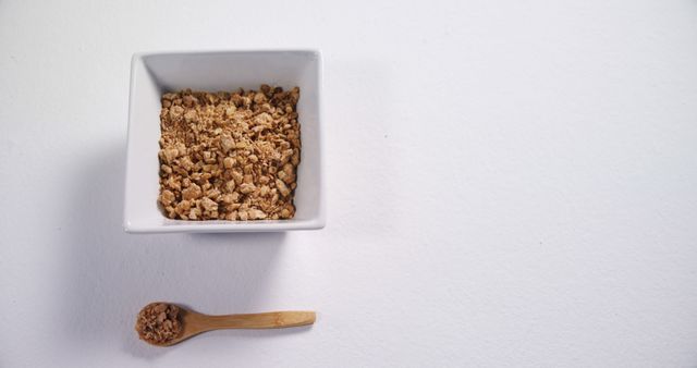 Top View of Granola Muesli in White Bowl on White Background - Download Free Stock Images Pikwizard.com