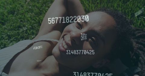 Happy Woman Reclining on Green Grass with Digital Numbers Overlay