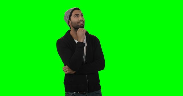 Man thinking with hand on chin against green screen background. Perfect for use in projects requiring diverse use cases. Ideal for promotional materials, editing or inserting text and images, contemplation themes, business and educational presentations, and digital content creation.