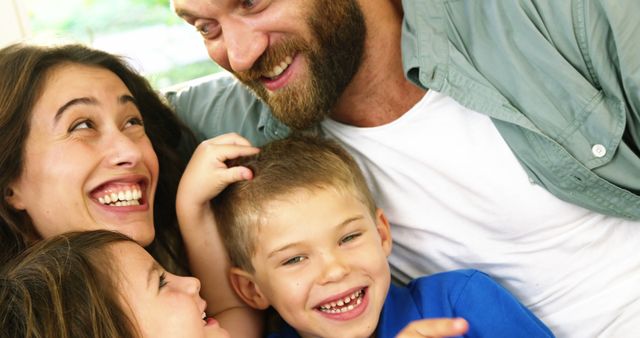 Happy Family Laughing and Enjoying Quality Time Together - Download Free Stock Images Pikwizard.com