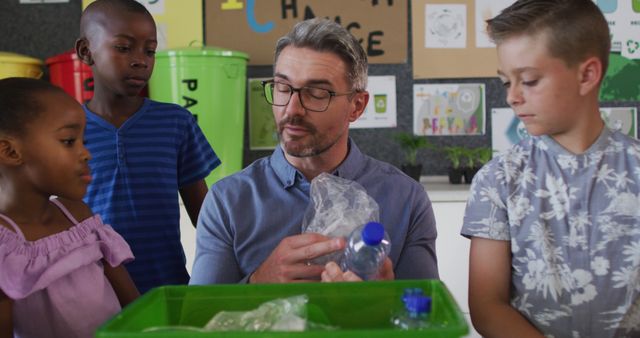Teacher explaining which plastics are recyclable to young students in a classroom. Ideal for content on education, environmental awareness, sustainability, and eco-friendly practices.