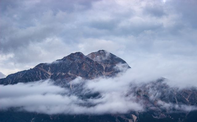 Cloud Covered Mountain Peaks in Early Morning Light - Download Free Stock Photos Pikwizard.com