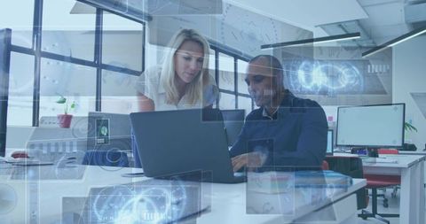 Team Collaborating Over Laptop with Futuristic Holographic Interface in Modern Open Office