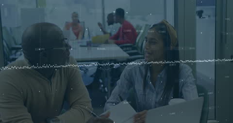 Business Team Discussing Financial Data in Office