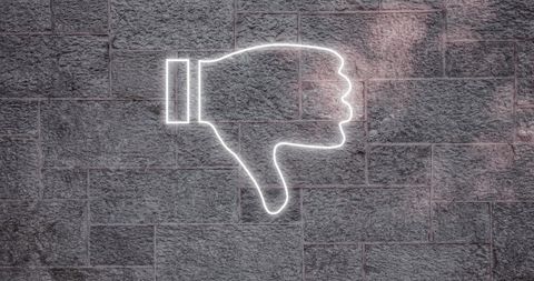 Neon Thumbs Down Icon on Gray Brick Wall - Download Free Stock Images Pikwizard.com