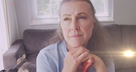 Thoughtful senior woman reflecting loneliness awareness