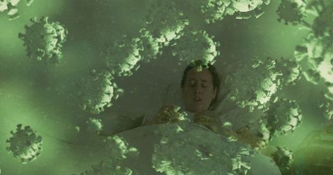 Woman in hospital bed under virus graphic overlay