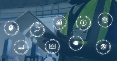 Technicians Analyzing Digital Analytics in Warehouse with LED Vests